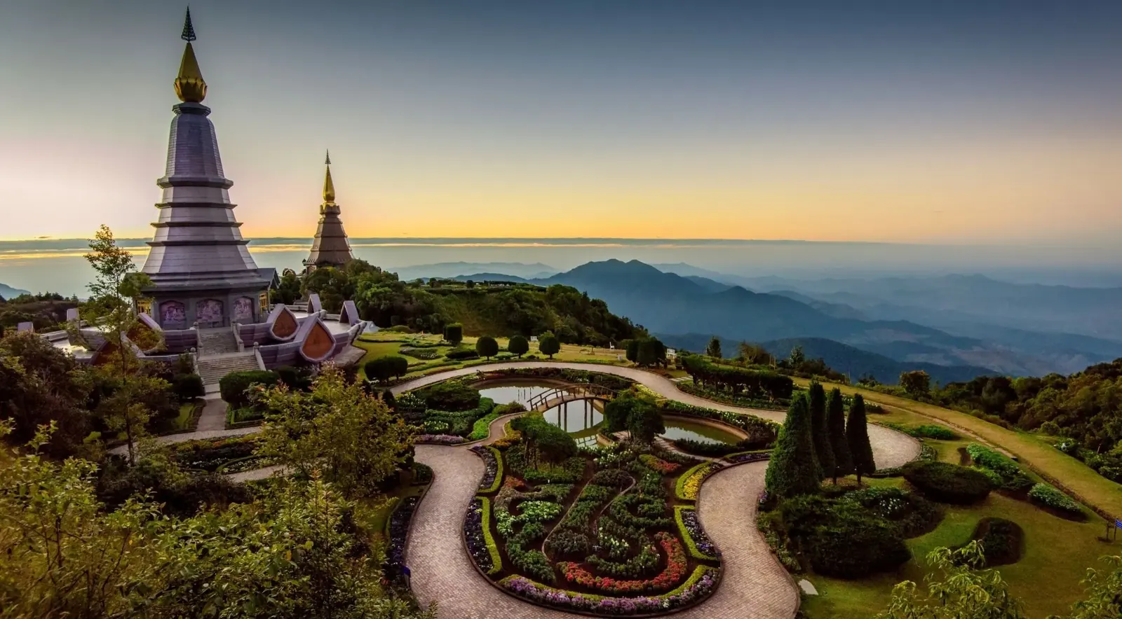 Pagoda gardens above forested mountain slopes
