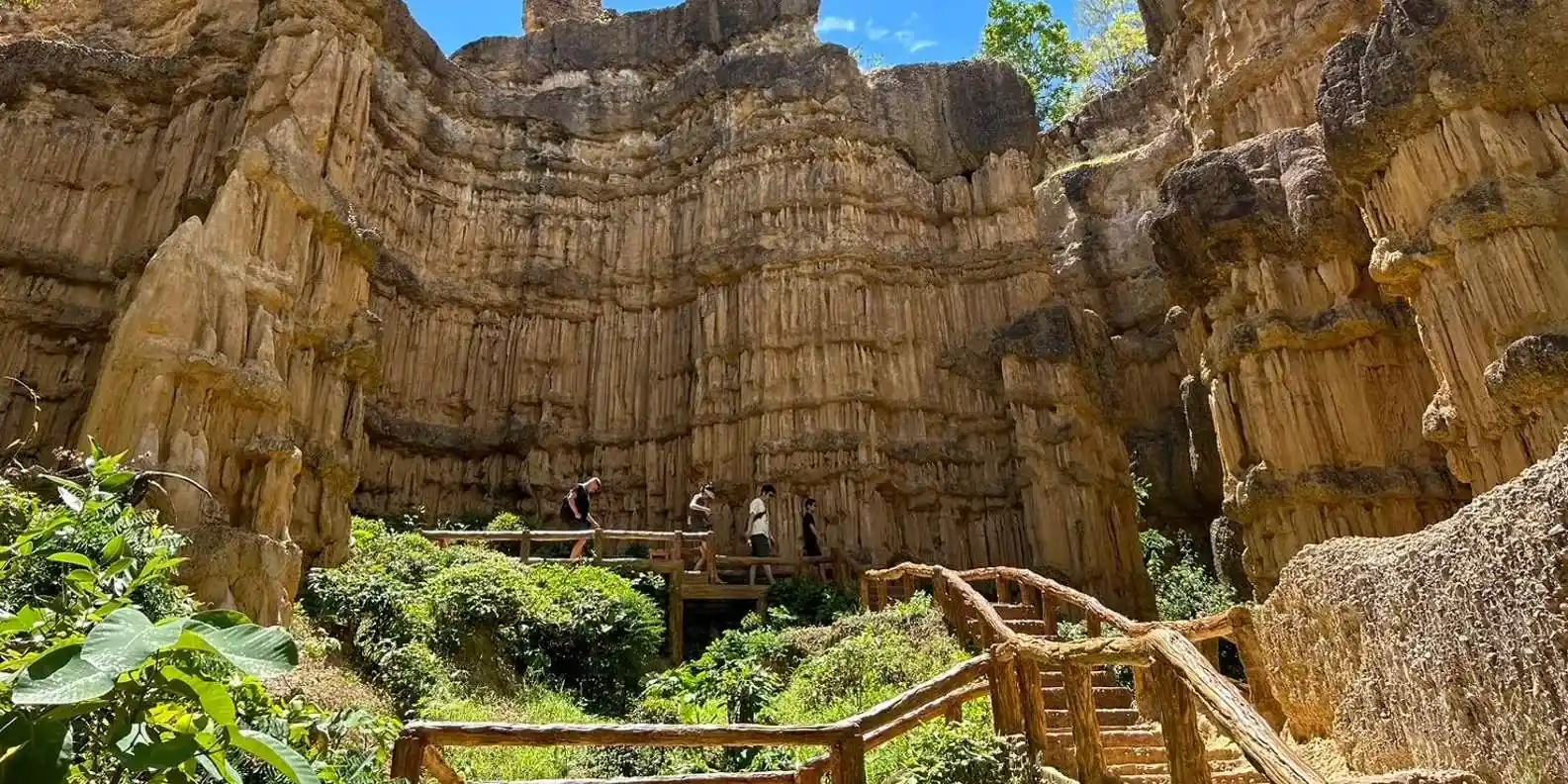 Wooden stairs beneath canyon cliffs